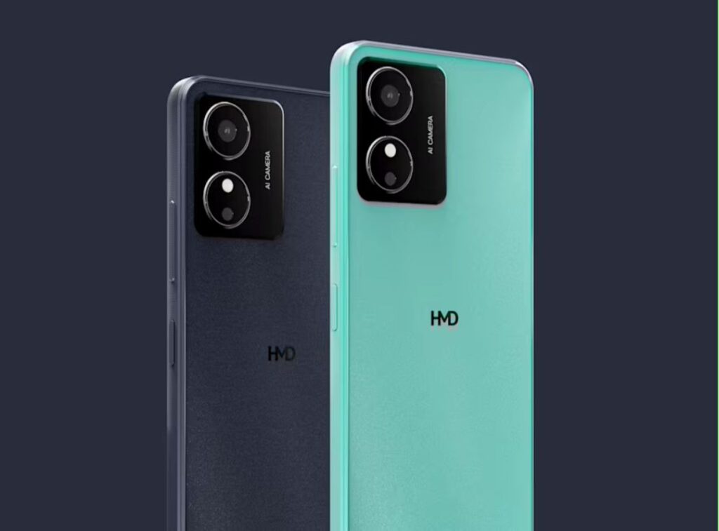 Close-up view of two HMD Key smartphones, one in teal and one in dark gray, showcasing their rear designs. Both phones feature a square camera module with the text 'AI CAMERA' and the HMD logo visible