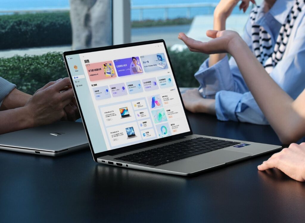 a people meeting with wiko hi matebook 14 laptop on the top of the table.