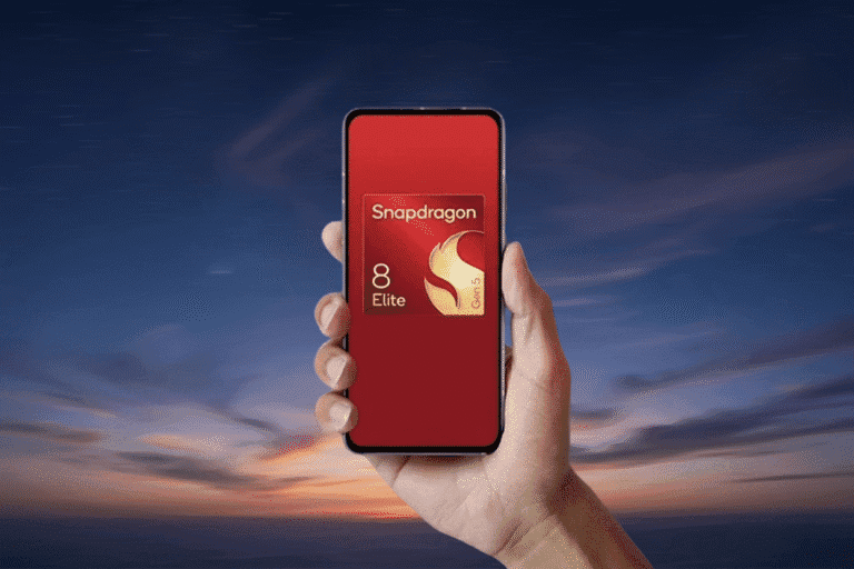 A hand holds a smartphone with a red screen showcasing the Snapdragon 8 Elite Gen 5 logo. The background features a vibrant sunset sky.