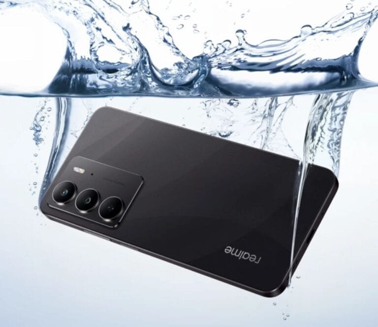 Product shot of a black Realme C75 smartphone partially immersed in water. Water droplets and splashes surround the phone, emphasizing its water-resistant design and features. The phone's camera module is clearly visible. The Realme logo is visible on the back.