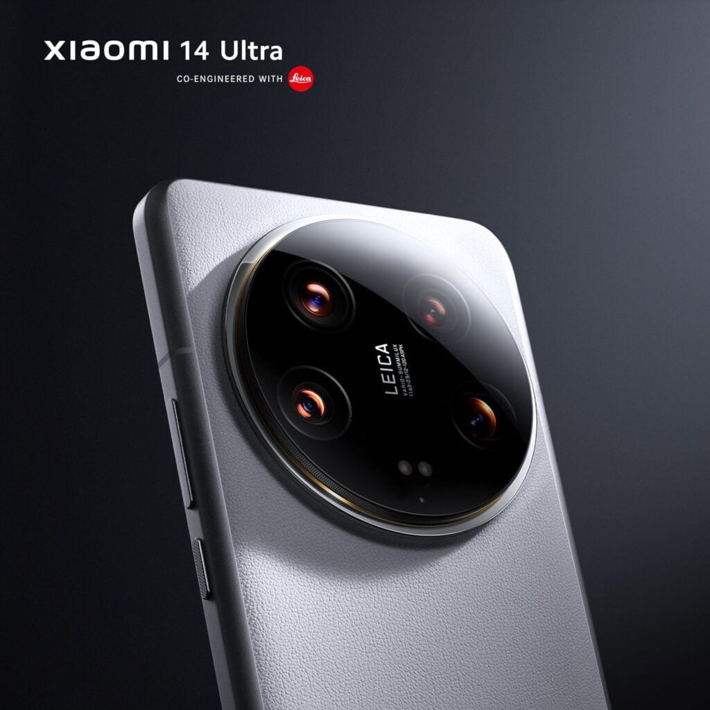 A close-up of the Xiaomi 14 Ultra phone, showing its Leica camera module with three lenses, one periscope, and zoom details.