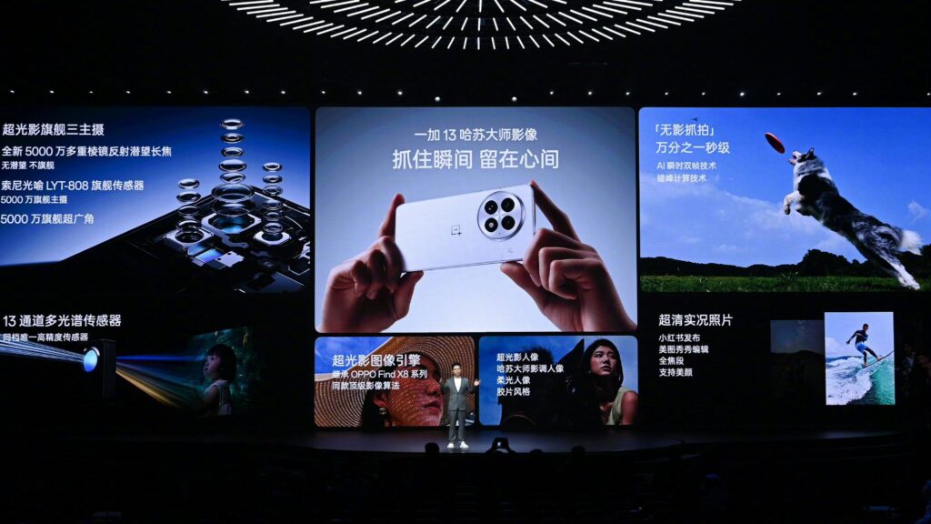 a person standing in the stage presenting the launching of an smartphone.