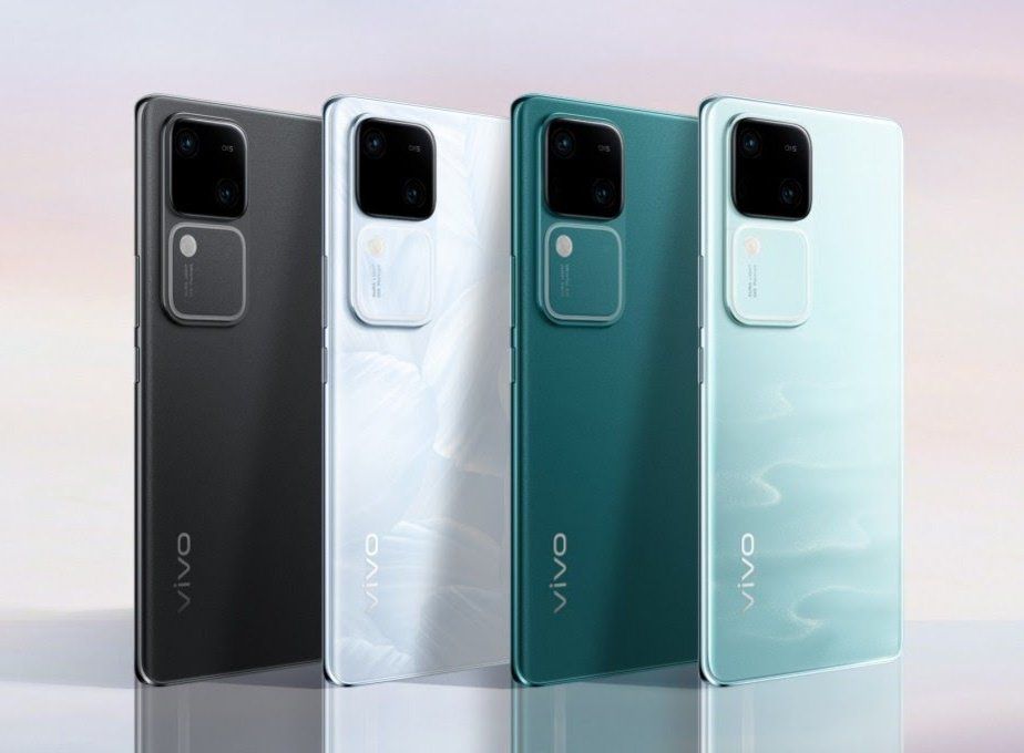 Vivo V30: A midrange Smartphone with Snapdragon 7 Gen 3 and 50MP Camera 2 Four Vivo V30 5G smartphones in dark grey, white, green, and light blue colors, standing upright side by side on a gradient background.