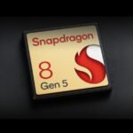 Qualcomm Snapdragon 8 Gen 5 Leaked Specs with Oryon CPU and Adreno 840 GPU 3 A close-up of the Snapdragon 8 Gen 5 chip logo, featuring a gold background with red and white accents, on a black surface.