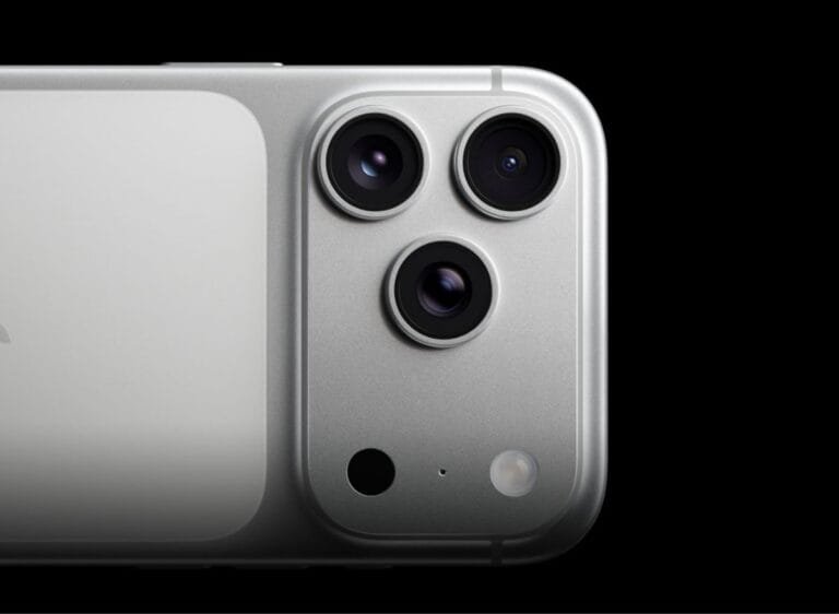 iPhone 17 Pro Max Camera | Triple 48MP Cameras and Professional Video Upgrades Close-up of the iPhone 17 Pro Max's silver finish with its triple-lens camera system, microphone, and flash, set against a stark black background.