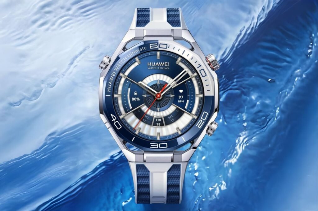 HUAWEI Watch Ultimate 2 Launches in the Philippines for ₱44,999 1 Close-up of the Huawei Watch Ultimate, featuring a blue and silver design with a detailed watch face displaying battery percentage, heart rate, and the date, set against a blurred blue water background.