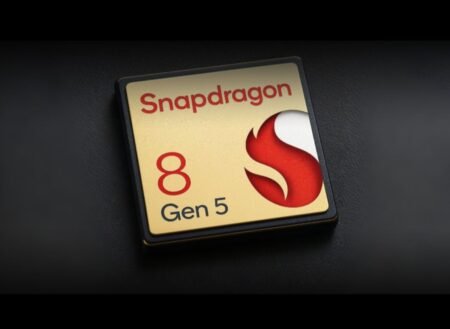 Qualcomm Snapdragon 8 Gen 5 Leaked Specs with Oryon CPU and Adreno 840 GPU A close-up of the Snapdragon 8 Gen 5 chip logo, featuring a gold background with red and white accents, on a black surface.