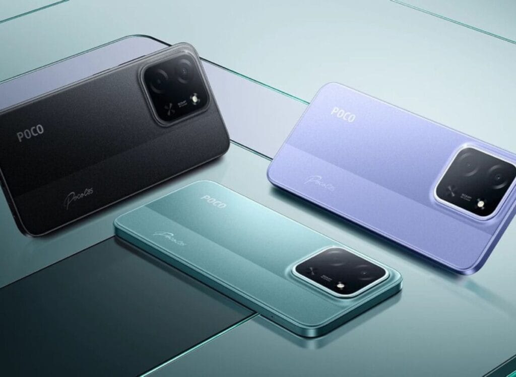 Poco C85 Global Launched | 6.9" LCD Display, Mediatek Helio G81-Ultra, and 6,000mAh Battery 1 Three Poco C85 smartphones in black, purple, and green are displayed on a reflective surface, highlighting their rear camera design and color variations.