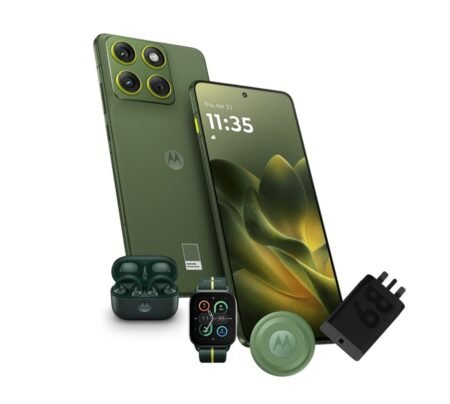 Motorola Edge 70 smartphone in Pantone Bronze Green, showcasing its quad-camera setup, accompanied by matching earbuds, smartwatch, and charging adapter.