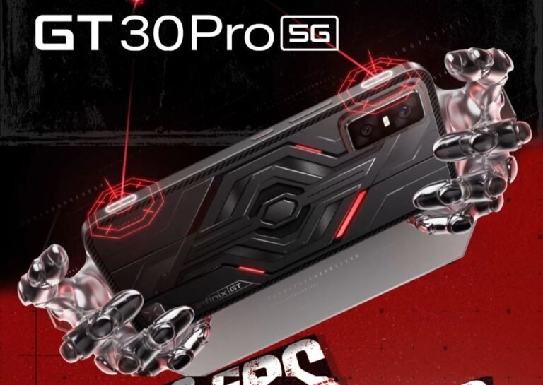 A close-up promotional image of the Infinix GT 30 Pro 5G gaming phone. The phone is held by metallic robotic hands, highlighting its sleek, black design with red accents and prominent camera module. Gaming shoulder buttons are visible.
