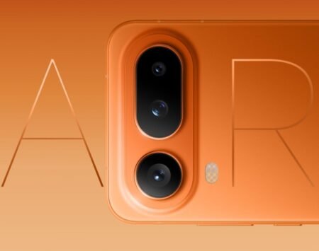 Close-up of the orange Honor Magic 8 Pro Air smartphone's rear camera module and back panel, featuring three camera lenses in a vertical layout and stylized 'A' and 'R' lettering in the background.