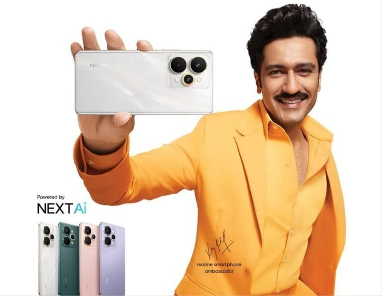 A promotional image for the Realme 15 Series smartphones. A man in a bright yellow blazer holds up a silver Realme 15 phone. Below, three additional Realme 15 phones in different colors (silver, green, and purple) are displayed. The image includes the tagline "Powered by NEXTAi" and the signature of a Realme smartphone ambassador.