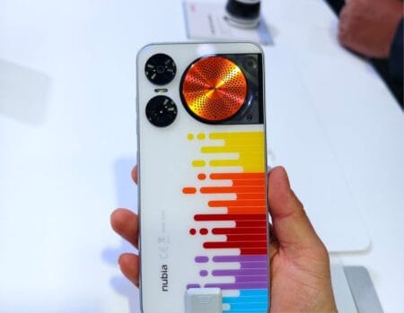 Close-up of the back of a Nubia Music Pro smartphone, showcasing its triple-speaker design and colorful soundwave graphic.