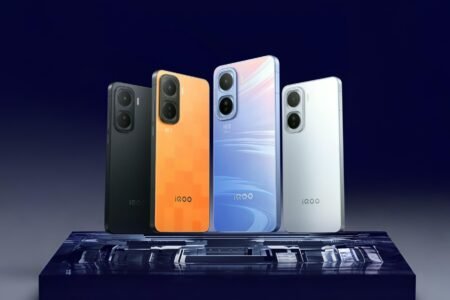 iQOO Neo 11 Launched in China with a Starting Price of ¥2699 A lineup of iQOO Neo 11 smartphones in various colors (black, orange, blue, and white) displayed on a reflective surface.