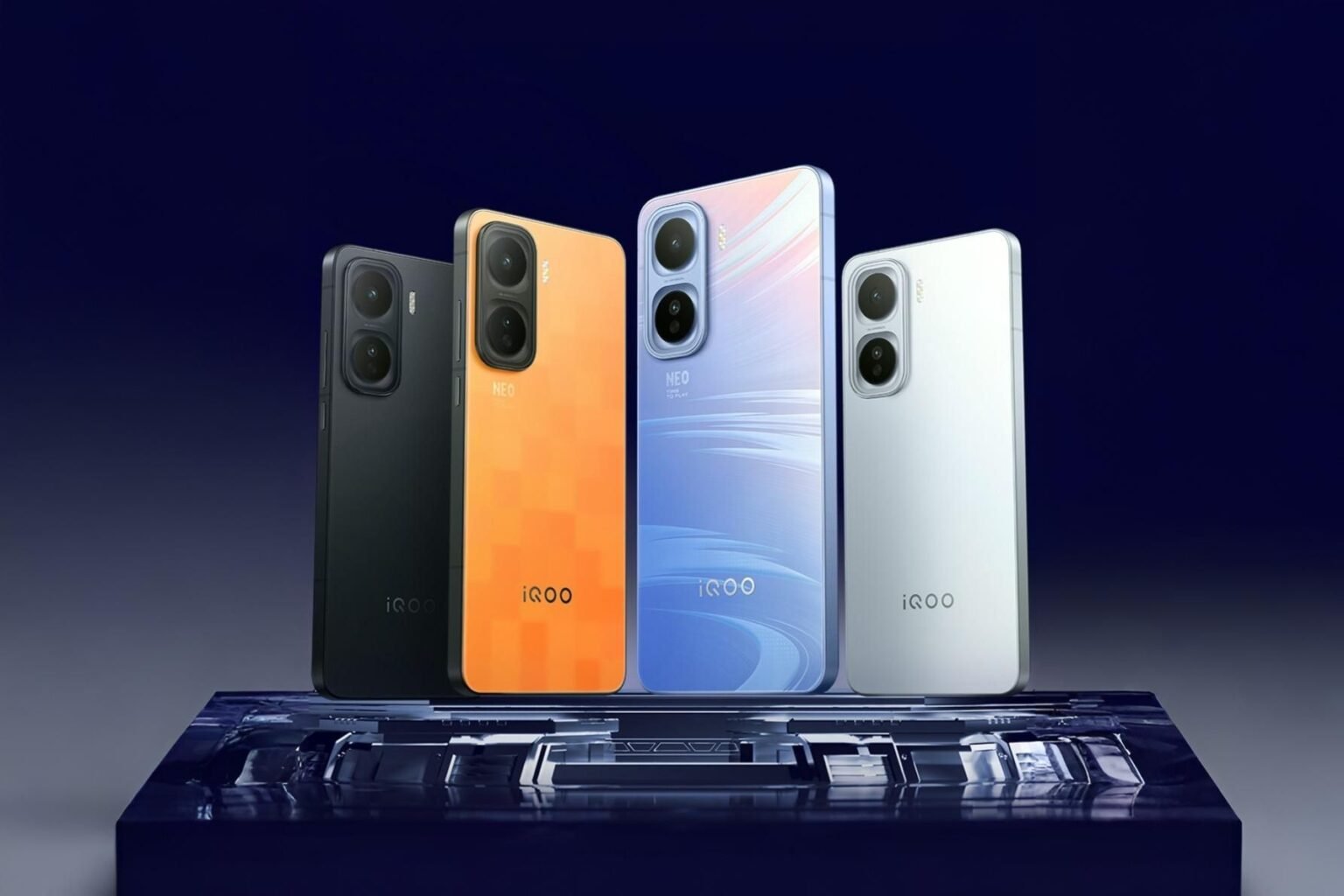 A lineup of iQOO Neo 11 smartphones in various colors (black, orange, blue, and white) displayed on a reflective surface.