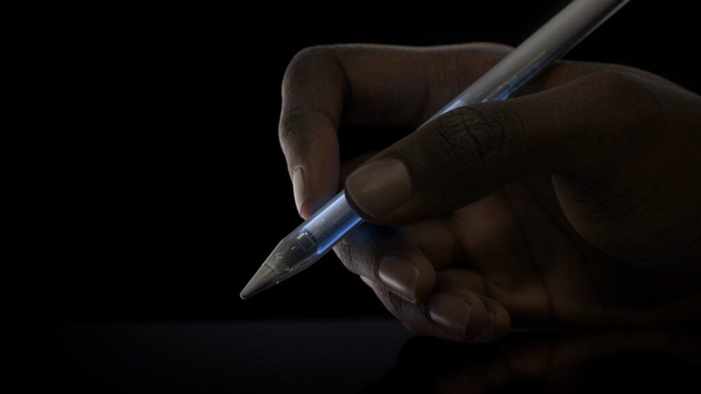 a person holding the apple pencil pro