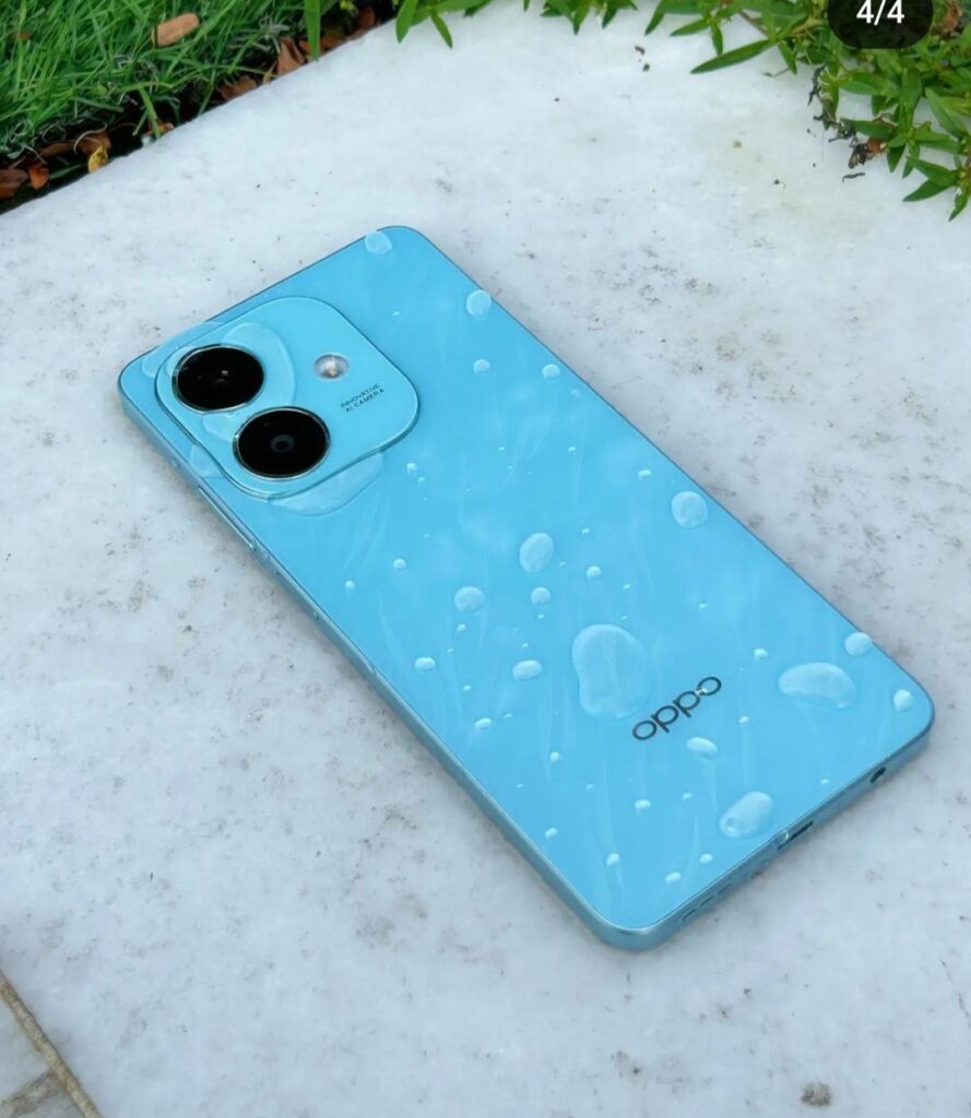 a photo of oppo a3x in color blue variant with splashes water at the back panel.