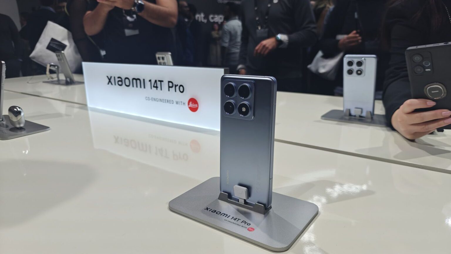 a smartphone xiaomi 14t series placed in phone stand at xiaomi store