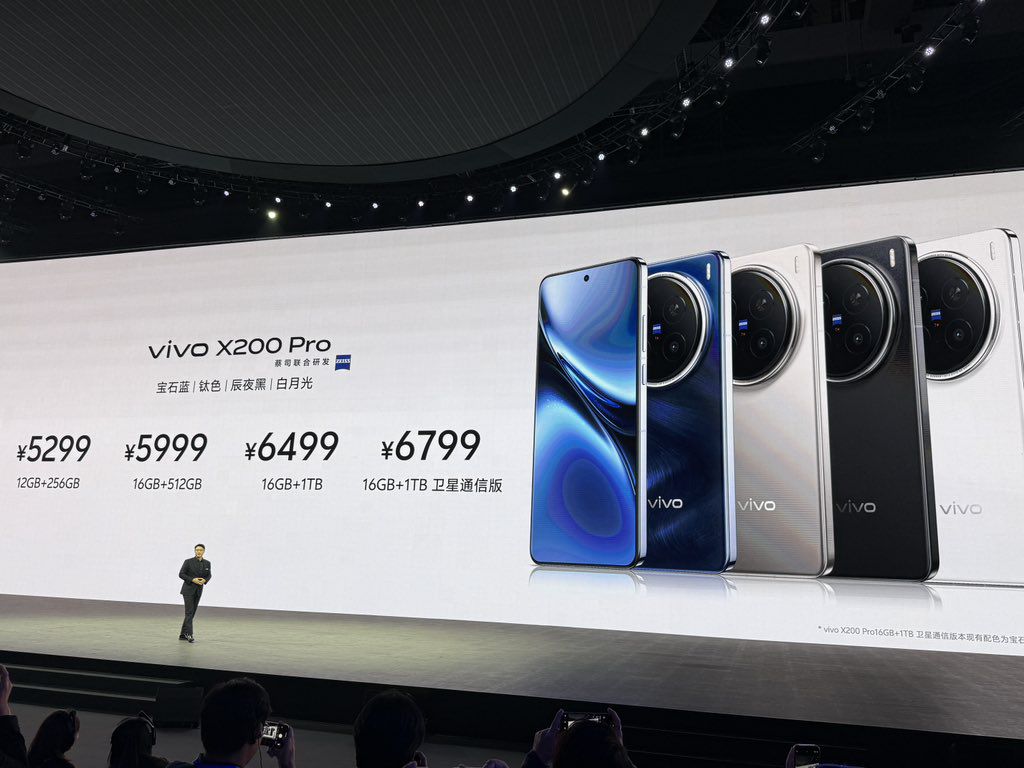 a person in a stage event presenting the features and price of the vivo x200 pro in china