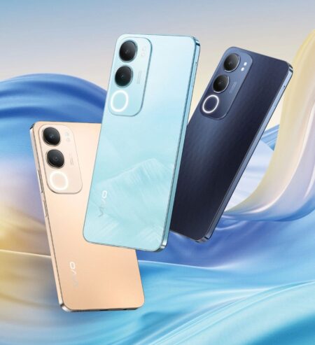 Three Vivo Y29 5G smartphones in Glacier Blue, Titanium Gold, and Diamond Black are shown, floating against a soft blue and gold abstract background. Each phone displays its rear camera array prominently.