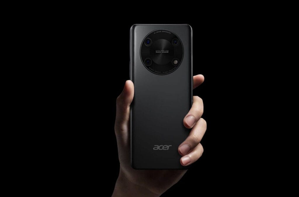 Acer Launches Super ZX and Super ZX Pro Smartphones in India 2 Close-up product shot of the Acer Super ZX Pro smartphone held in a hand. The focus is on the phone's rear, highlighting its sleek black design and distinctive circular camera array with visible lens details and text indicating features like AI Image Enhancer and LYTIA sensor.