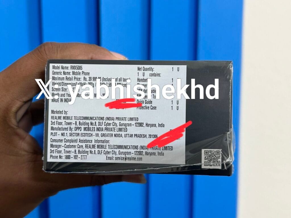 Realme GT 7T RMX5085 Indian Variant Retail Box Spotted: ₹39,999 Price Tag 1 Three Realme GT 7T smartphones shown in a promotional image. The phones are displayed in blue, yellow, and black, showcasing their sleek design and camera modules. The text "Realme GT 7T" and "Power That Never Stops" are prominent.