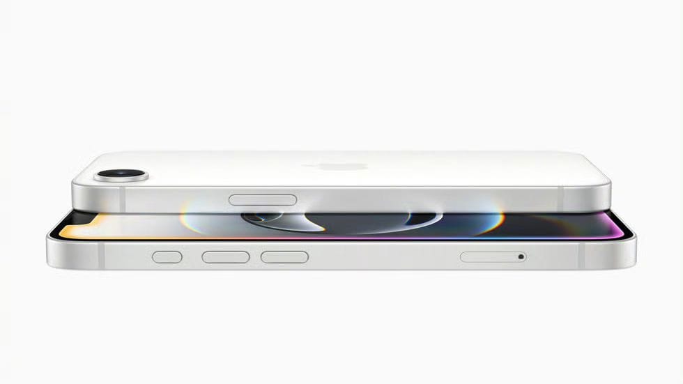 Apple Launches Budget-Friendly iPhone 16e at PHP 39,990 2 The image shows two white Apple iPhone 16e devices stacked on top of each other, showcasing their thin profile and design elements. The top phone is slightly angled, revealing the camera lens and Apple logo. The bottom phone shows a portion of its screen with a colorful abstract wallpaper. The image highlights the phone's overall slimness and minimalist aesthetic.