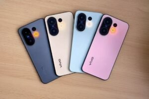 Four Vivo S50 Pro Mini phones in blue, cream, light blue, and pink.