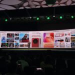 vivo X300 series launch event in India, with a presenter on stage and the phone's features displayed on a large screen.