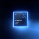 A glowing blue square chip with the text "Samsung Exynos 2600" and a small "5G" icon in the top left corner, set against a dark background with a vibrant blue neon outline.