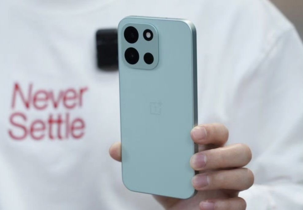 Leaked image of the OnePlus Turbo 6 in a light blue color, showing the rear camera setup and OnePlus logo.