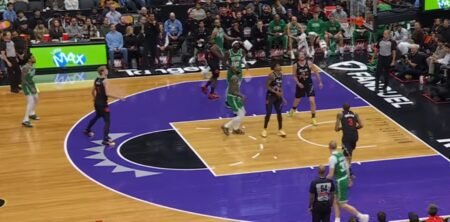 Image from an NBA game, with players on the court; December betting promos offer over $8000 in bonuses.