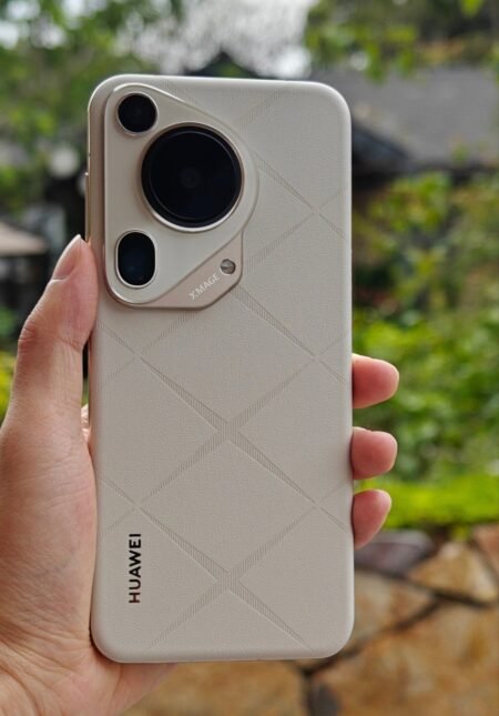 Huawei Pura 70 series debuts in china: specs, price and availability a person holding the huawei pura 70 ultra