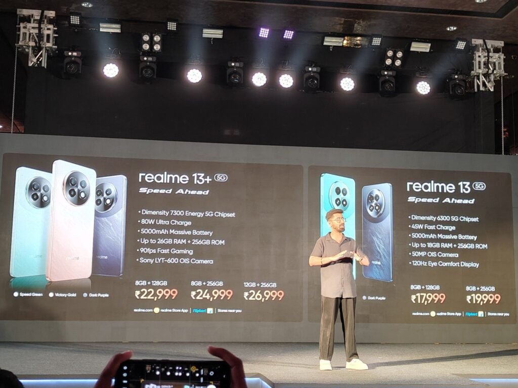 a person presenting the launch event of realme 13 plus 5g in india