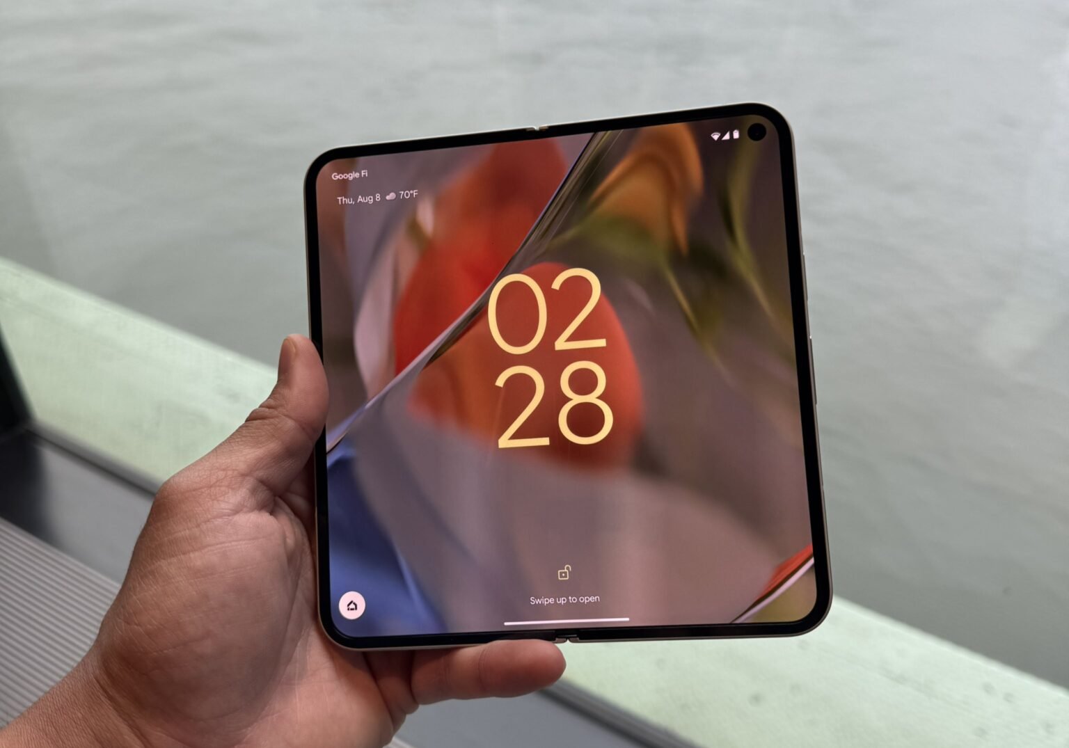 a person holding the google pixel 9 pro fold