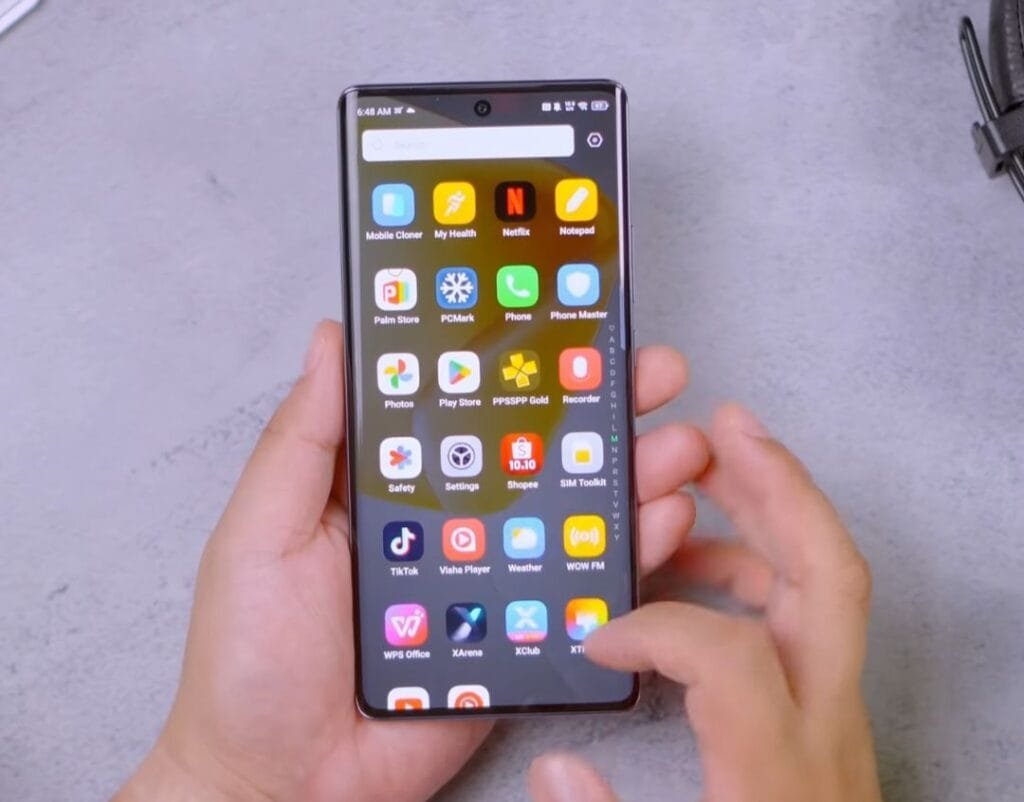 a person touching the infinix hot 50 pro+ 5g showing the phone's user interface