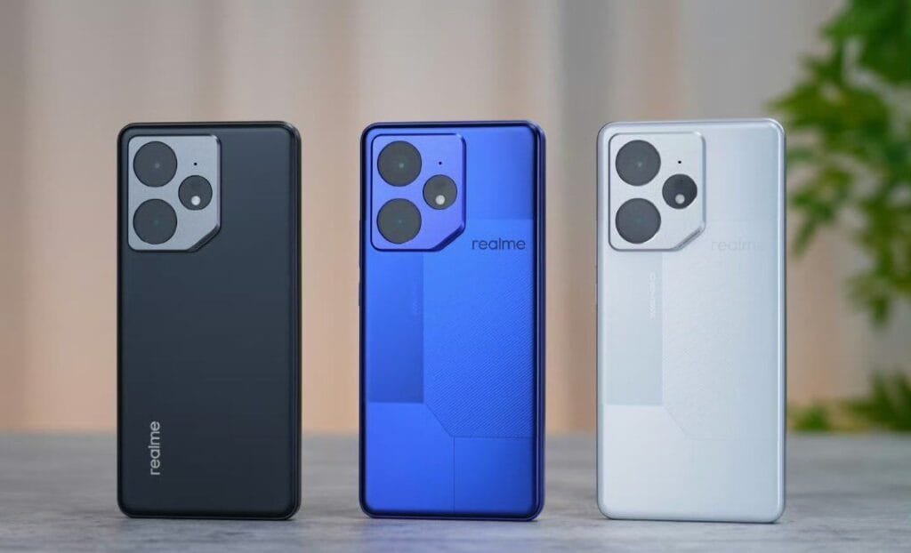 Three Realme Neo 7 features smartphones showcasing different color options: silver, dark gray, and blue. The image highlights the phone's design and camera features.