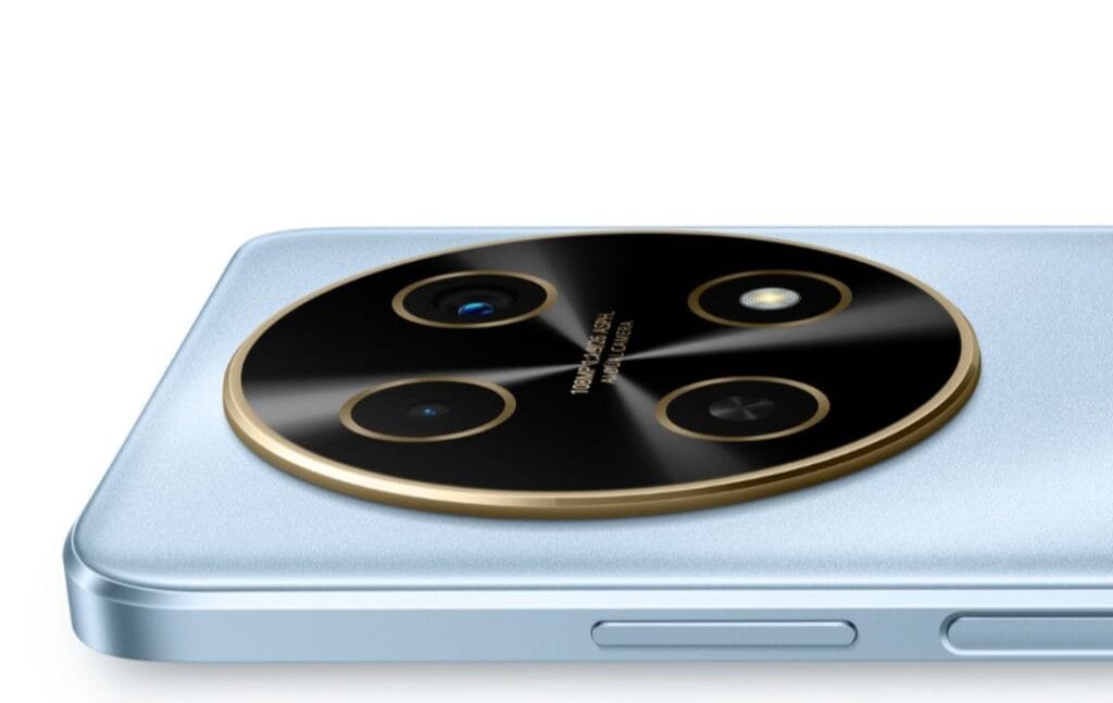 Close-up view of the circular camera module on a light blue Huawei Nova 13i smartphone. The module features multiple lenses and a gold-colored ring around a black, glossy surface.  Small text on the module indicates '100MP f/1.6 ASPH. AI DUAL CAMERA'.