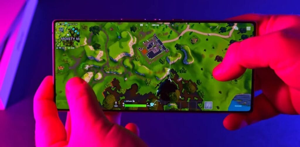 The RedMagic 10 Pro has officially arrived in the Philippines: Snapdragon 8 Elite, 7,050mAh battery. Price at ₱49,999 3 A person playing Fortnite on a RedMagic 10 Pro smartphone. The game's map is visible on the screen, showing a player in the pre-game phase.