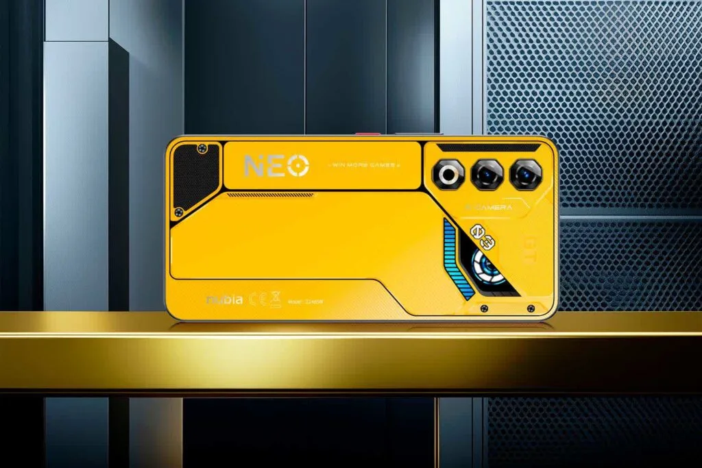 Nubia Neo 3 GT 5G: 6.8" OLED Display, Unisoc T9100, and 6,000mAh Battery 1 A close-up product shot of the yellow Nubia Neo 3 GT 5G smartphone. The phone's back is prominently displayed, showcasing its distinctive design with a metallic-looking yellow finish, angular lines, and a camera module featuring three circular lenses. The Nubia logo is visible at the bottom. The phone rests on a gold-colored surface against a dark, textured background.