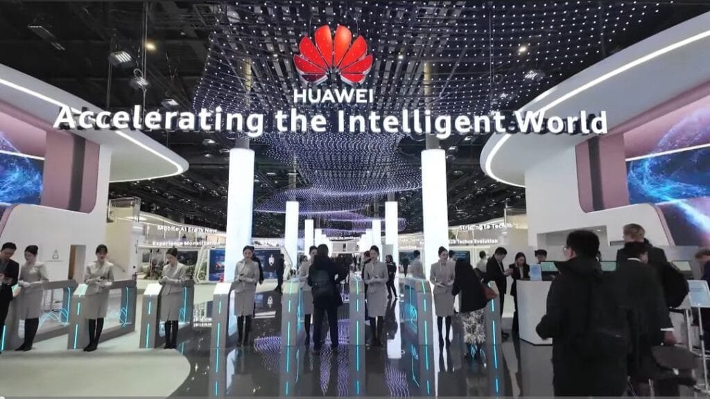 Huawei Smartphone Revenue Surges to $118 Billion in 2024 A vibrant display at MWC 2025 in Barcelona showcases Huawei's commitment to accelerating the intelligent world. The image highlights the Huawei brand and features attendees interacting with technology demonstrations, suggesting a focus on the latest Huawei smartphone innovations and advancements.