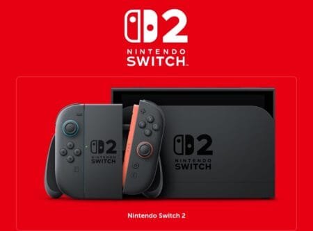 Nintendo Switch 2 Confirmed to Launch on June 5, 2025 A sleek, black Nintendo Switch 2 Camera sits on a circular base with a tall, slender stand. The camera lens is centrally located on the top, and a cable is visible running down the stand to the base.
