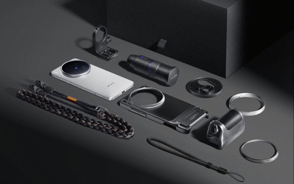 Vivo X200 Ultra Launched in China: 2K AMOLED Display, 50MP Sony LYT-818, and 200MP Periscope Telephoto 3 The Vivo X200 Ultra smartphone is displayed alongside its professional photography kit. The kit includes additional lenses, a phone case, straps, and other accessories designed to enhance the phone's photographic capabilities.