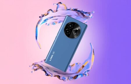 A stylish blue Lava Bold 5G smartphone is shown elegantly positioned within a dynamic splash of water, set against a gradient pink and purple background.