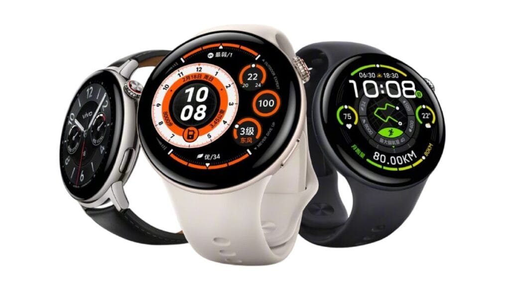 Three Vivo Watch 5 smartwatches displayed, showcasing different watch faces and strap colors. One watch has a black face and black strap, another has a white face and beige strap, and the third has a dark gray face and black strap. All watches feature a circular design with a prominent digital clock display.