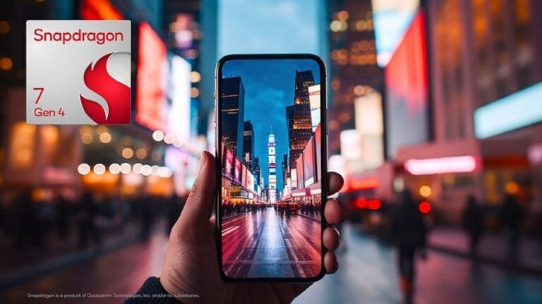 ‎A close-up shot of a person's hand holding a smartphone showcasing a stunning, brightly lit city street at night. The Snapdragon 7 Gen 4 logo is visible in the background, suggesting the phone's processor.