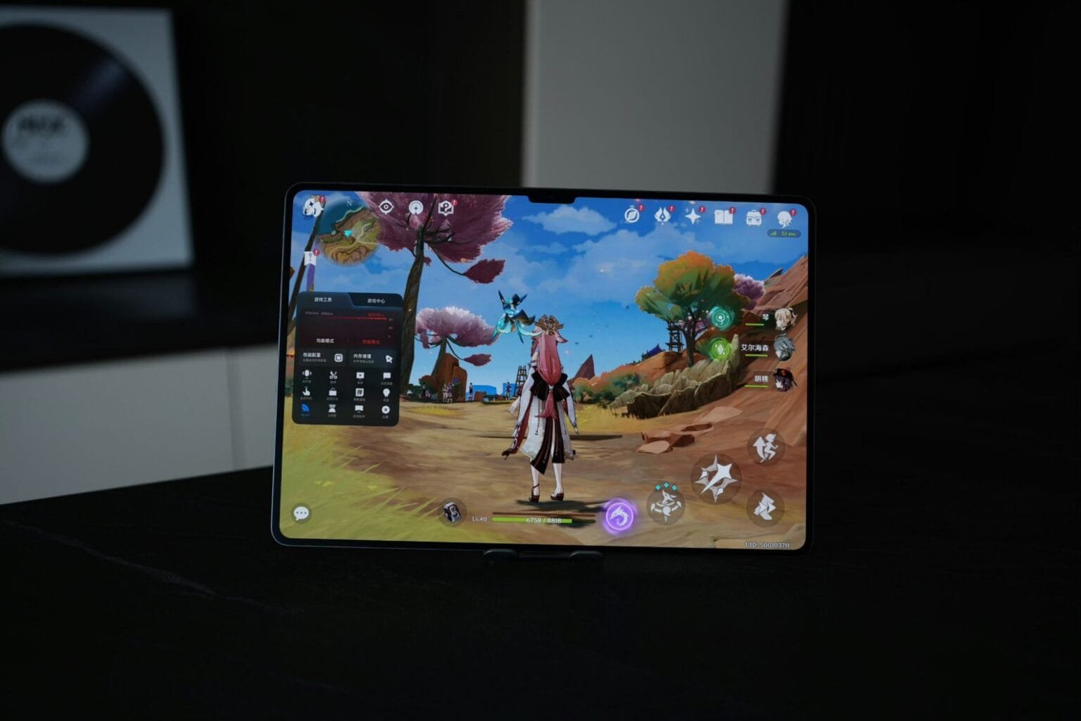 Xiaomi Pad 7 Ultra launched: 14″ TCL M9 OLED Display, Xring 01, and 50MP JN1 Camera A Xiaomi Pad 7 Ultra tablet is shown propped up on a stand, displaying a vibrant scene from the video game Genshin Impact. A character in the game is visible in the foreground.