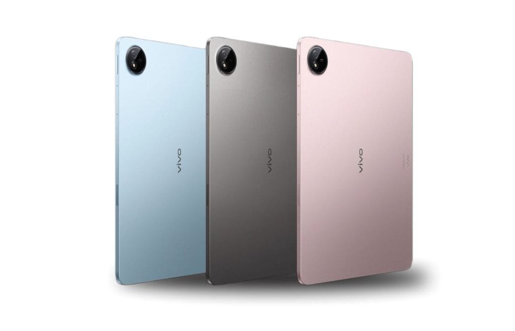 Vivo Pad 5 | 12.1" 2.8K IPS LCD Display, Dimensity 9300+ and 10,000mAh Battery 2 Rear view of three Vivo Pad 5 tablets displayed in light blue, dark gray, and rose gold. The tablets are positioned slightly angled, highlighting their slim profiles and minimalist design. The "vivo" logo is visible on each tablet.