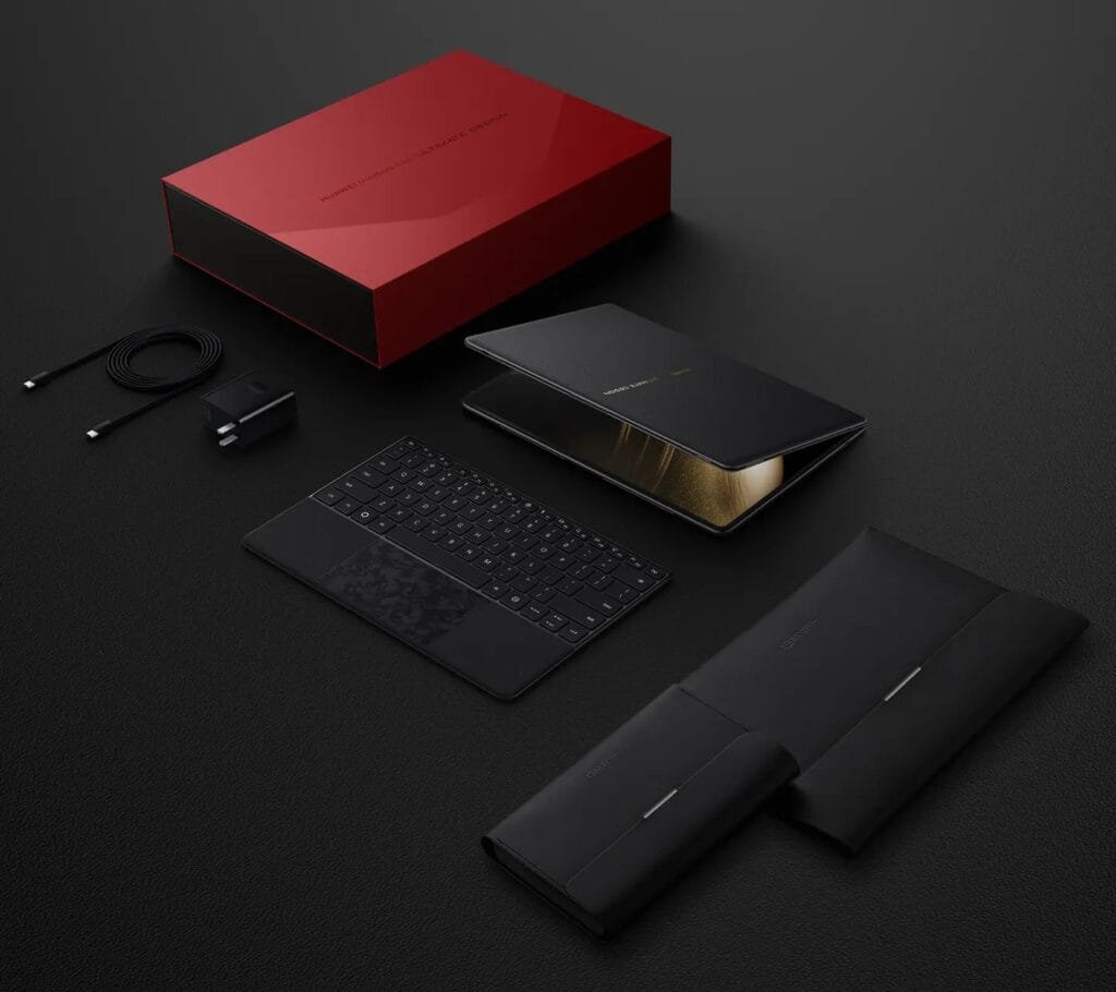 Huawei MateBook Fold | Ultimate Design Unveiled: 18" 3.3K OLED Display, Kirin X90, and 74.69 Wh Battery 2 A flatlay image showcasing the Huawei MateBook Fold's packaging and contents. A red box contains the foldable laptop, which is displayed partially open. Beside it are a black wireless keyboard, a charging cable and adapter, and two black protective sleeves. The scene is set on a dark background.