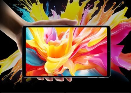 Teclast Unveils the T50 Mini: A Pocket-Sized Tablet with Mediatek Helio G99 Close-up of a person's hand displaying the Teclast T50 Mini tablet. The screen shows a colorful abstract image of swirling paint, highlighting the tablet's bright and vivid display.